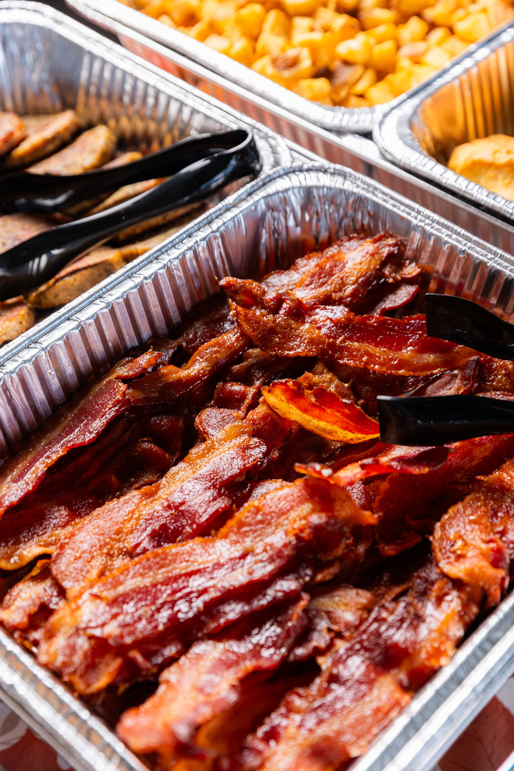 Close up of Bacon Strips in a Catering tin container