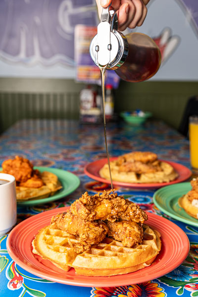 Chicken and Waffles with Syrup Pouring