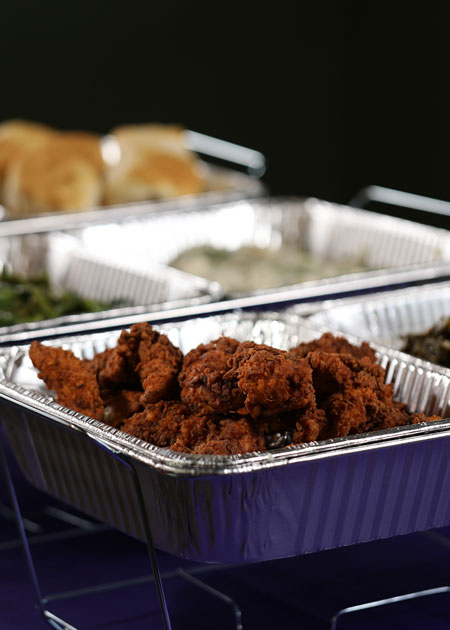 Side shot of fried chicken in a catering buffet tin